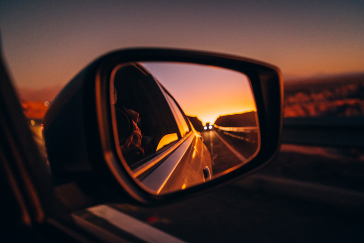 Side mirror view on the road